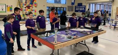 Participants in the First Lego League watching a match