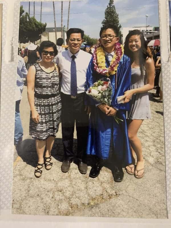 A picture of myself (Devin Lu) and my family at my high school graduation.