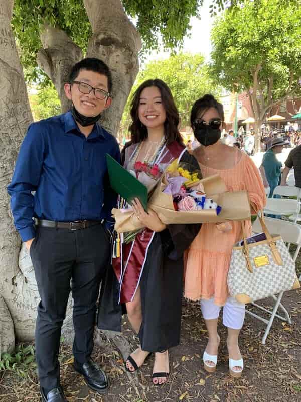 A picture of me, my mom, and my sis at her college graduation at Woodbury.